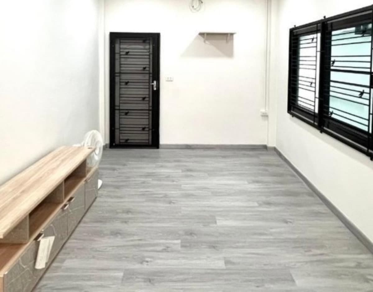 Room-wide SPC flooring reference showing floor colour direction in a real interior setting